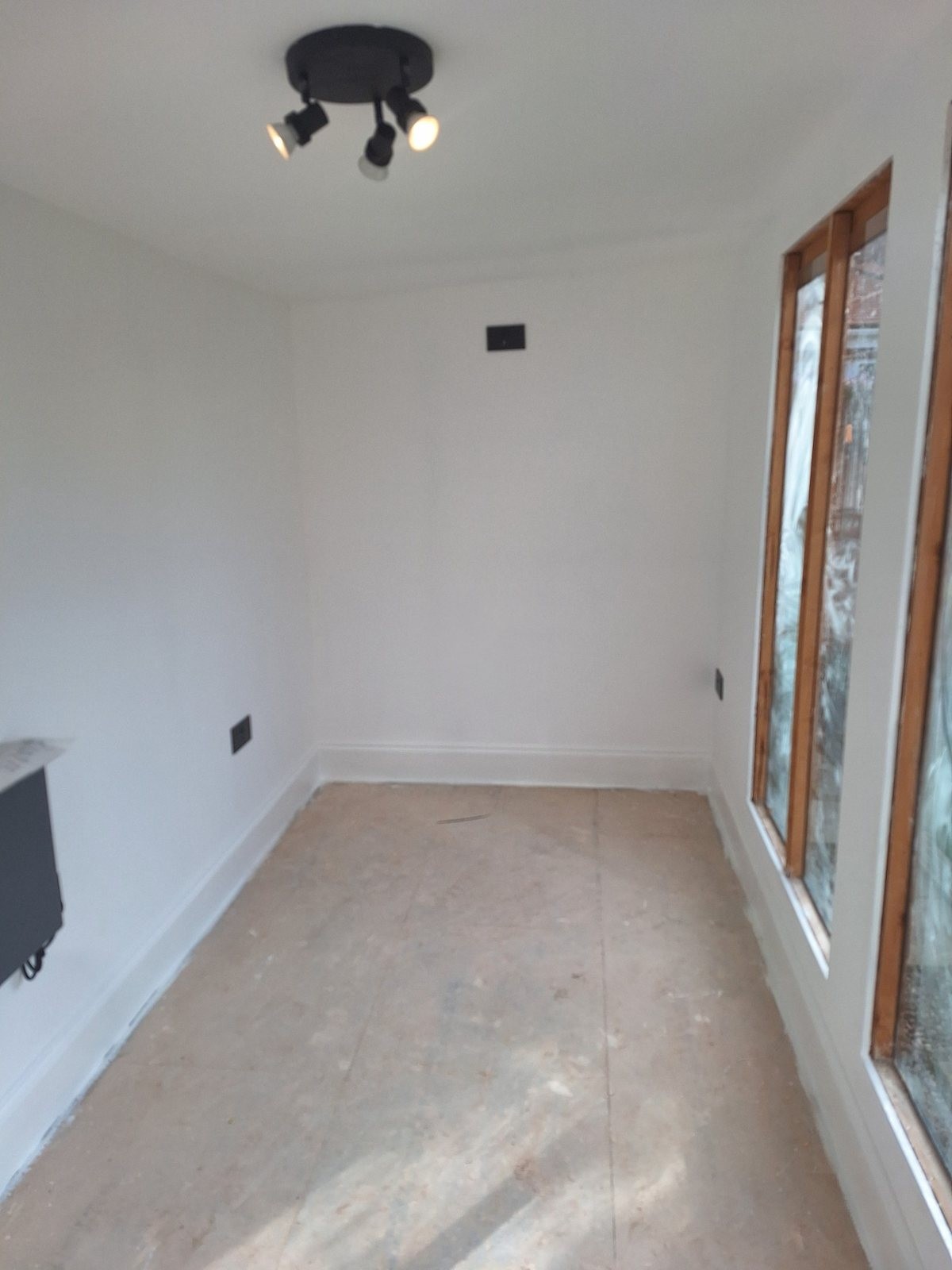 Summerhouse assembly and fit-out — Painted interior alternate view